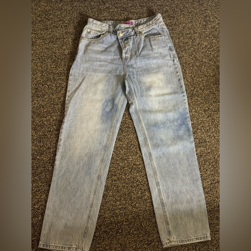 Cross over jean with button fly! Never been worn! No Tag!